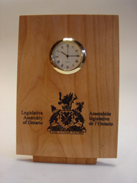 Flat Tilted Clock with logo imprint - 4"w x 6"h x 2" d - 1 3/8" diameter quartz mechanism.